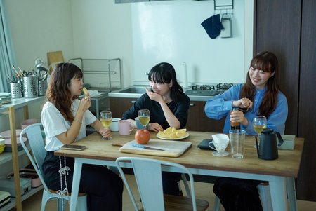 Young women having lively conversation in the room