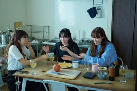 Young women having lively conversation in the room