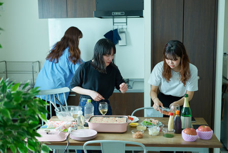 Young women preparing for a house party
