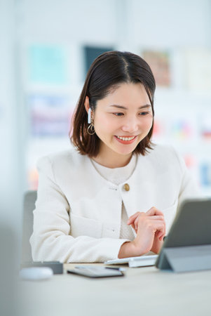 A young woman in an online meetingの写真素材