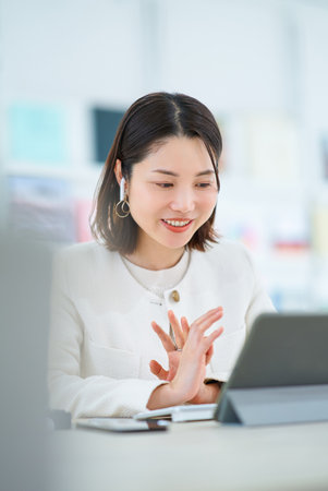 A young woman in an online meetingの写真素材