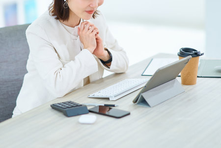 A young woman in an online meetingの写真素材