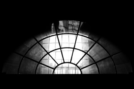 Semi round church window on black and whiteの写真素材