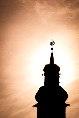 Tower silhouette on a orange skyの写真素材