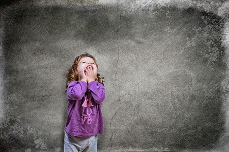 Joyful beautiful girl in night suit thinking at stars and heartsの写真素材