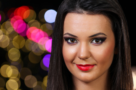 Beautiful girl with professional makeup - night portraitの写真素材