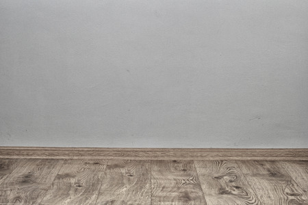 Indoor background with oak parquet and wallの写真素材