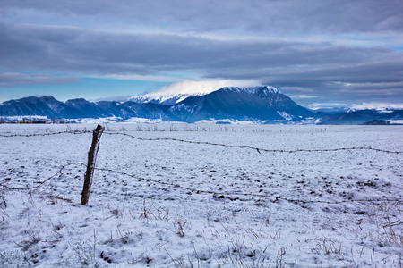 Piatra Craiului mountain massive in Brasov county, Romania view from East during winterの写真素材