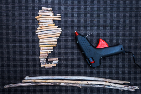 Seahorse shape made from driftwood as home decoration object with glue pistolの写真素材