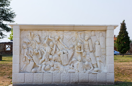 Alba Iulia, Romania - August 26, 2012: Stone scultpure ilustrating a Daco-Roman battle in Alba Iulia city, Transylvania, Romaniaのeditorial素材