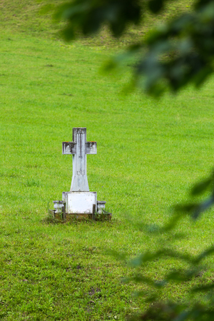 Orthodox marble cross in a garden from Romanian montain countrysideの写真素材