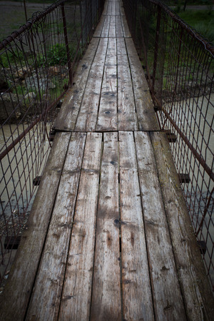 Old pedestrian suspended bridge in Buzau county, Romaniaの写真素材