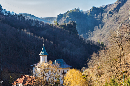 Turnu orthodox monastery in Cozia, Valcea county, ligthed by morning sunの写真素材