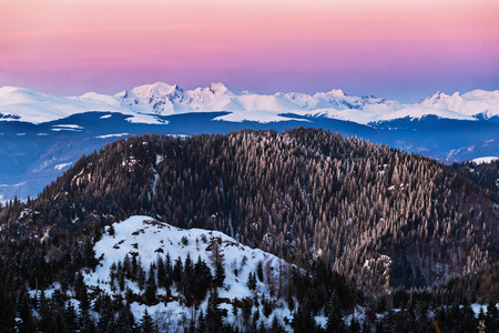 Picturesque mountain landscape during winter in Fagaras mounntain range, tallest in Romania Carpathians, at sunsetの写真素材