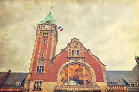 Old train station of Alsace touristic city Colmar with retro style filterの写真素材