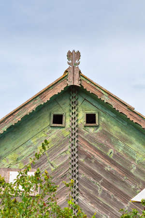Beautiful wooden decoration on the traditional fronton house in Danube Delta region, using fretwork techniqueの写真素材