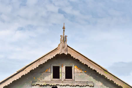 Beautiful wooden decoration on the traditional fronton house in Danube Delta regionの写真素材