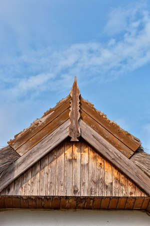 Beautiful wooden decoration on the traditional fronton house in Danube Delta regionの写真素材