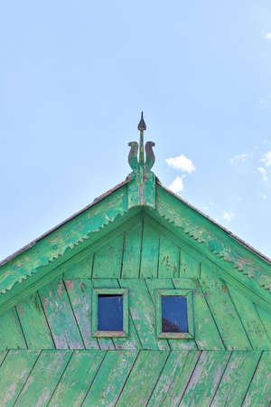 Beautiful wooden decoration on the traditional fronton house in Danube Delta regionの写真素材