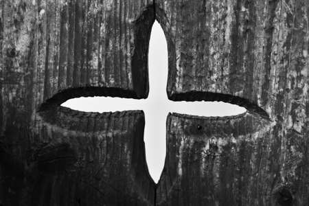 Star or cross model carved roughly on a wooden chairの写真素材