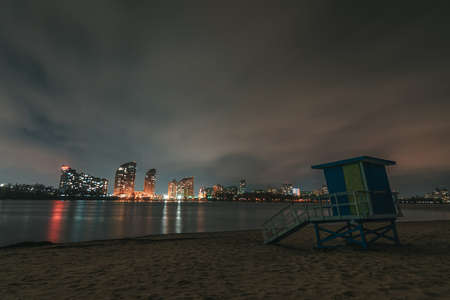 Panorama of the night city. Beach on the Dnieper River in Kiev. Lifeguard point on the beach in off season.の写真素材