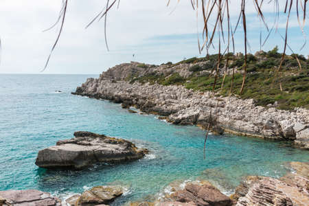 Mediterranean karst coast, blue water and rocky beach.の写真素材