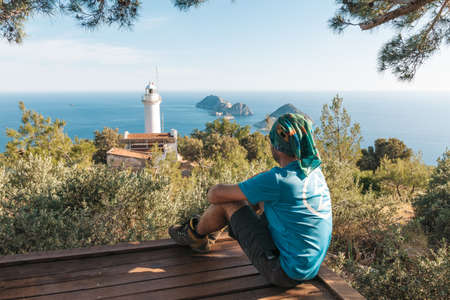 The tourist seating, reaching the path to the lighthouse. View of the lighthouse Helidonia from the Lycian Trail. Panoramas of the Mediterranean Sea.の写真素材