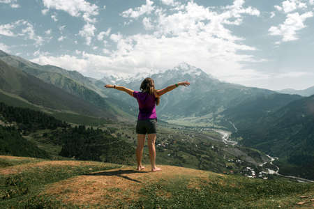 Young active girls hiking in Greater Caucasus mountains, Svaneti region, Mestia district, Svaneti,...