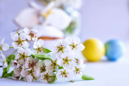 On grey wooden table cake, Easter cake in a basket or in a wooden, grey box, spring flowers, sweet table for the holiday, Easter Holiday, Easter decor.の写真素材