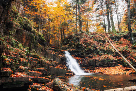 picturesque waterfall in the autumn forest. Nature of Ukraineの写真素材