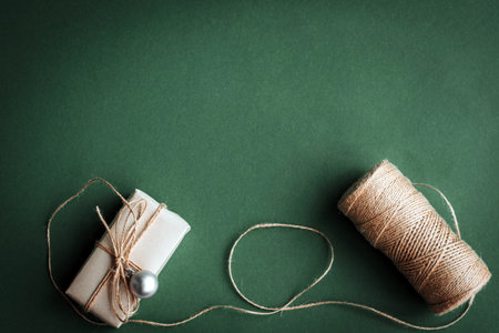 Christmas gift and decorations on olive background.