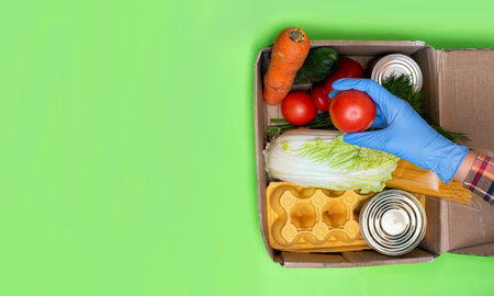 Delivery healthy food background. Vegan vegetarian food in paper bag vegetables and fruits on white, copy space, banner.Grocery shopping food supermarket and clean vegan eating concept.の写真素材