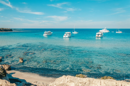 Tourist boats are mooring at Blue at Akamas peninsula on Cyprusの写真素材