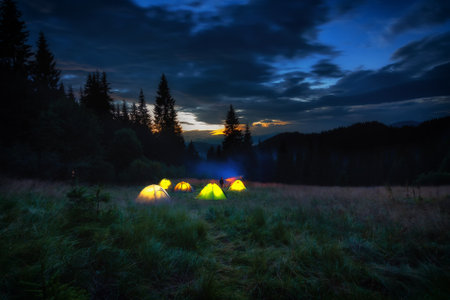 Tents glow at night in the forest ,Dnestrovskij-Kanon,Ukraineの写真素材