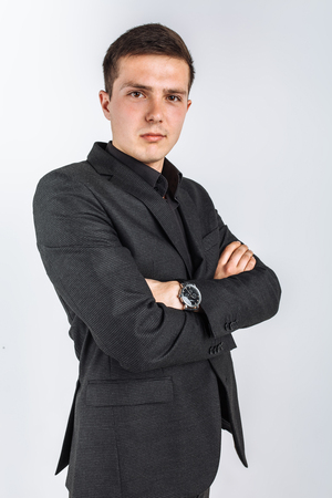 The guy in the Studio. The guy in the black suit. Handsome guy. High quality photoの写真素材