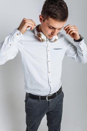 The guy in the Studio. The guy in the white shirt. Handsome guy. High quality photoの写真素材
