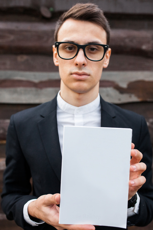 The guy, Boy represents or advertise something. Background with isolated place for textの写真素材