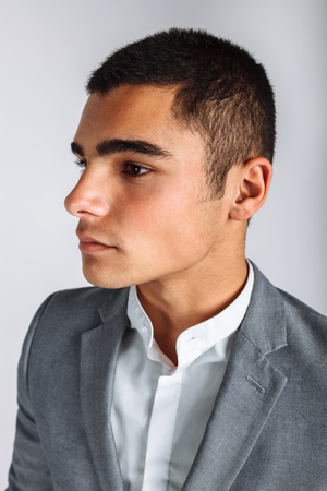 Portrait of the beautiful posing in a Studio. White background, isolated. Stylish business manの写真素材