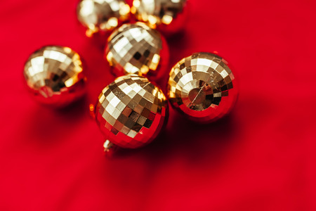 Christmas background. Balls of gold. Toys. The red background. Gold beadsの写真素材