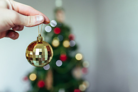 The hand holding the ball. Christmas background. New year. Holiday. Beautiful photoの写真素材