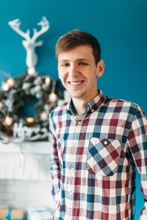 Beautiful portrait of a man, in shirt, Christmas studios, Christmas cheer, closeup