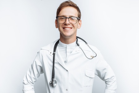 Portrait of a young doctor on a white background, Intern in the Studioの写真素材