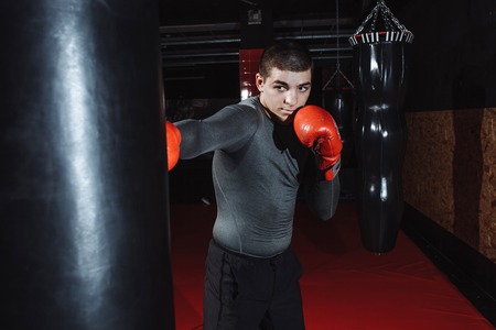 Boxer hits a speed bag in the gym