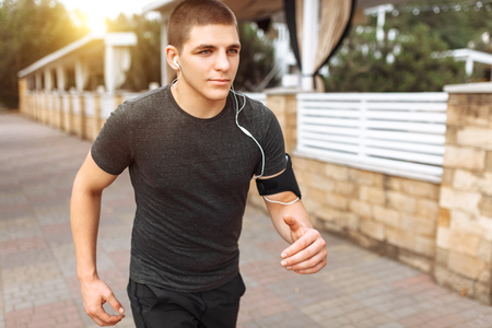 man makes a morning jog in the streets, sports training