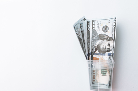 Many bills of 100 dollars, American banknote, white background with money cash currency close-up, President's faceの写真素材