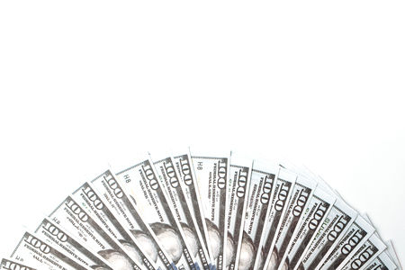 Many bills of 100 dollars, American banknote, white background with money cash currency close-up, President's faceの写真素材