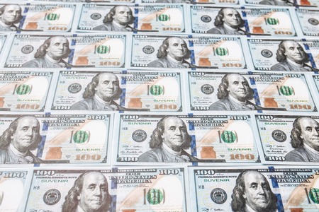 Many bills of 100 dollars, American banknote, background of money, cash currency close - up