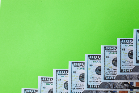 Many bills of 100 dollars, us banknote, green background with money cash currency close-up, President's faceの写真素材
