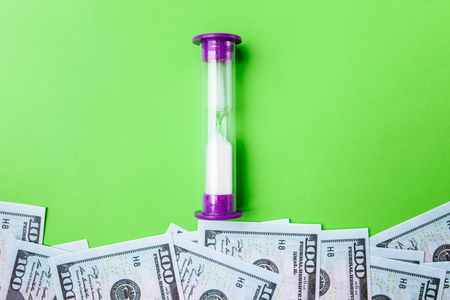 Many bills of 100 dollars, us banknote, green background with money cash currency close-up, concept time worth moneyの写真素材