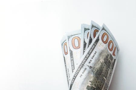 Many bills of 100 dollars, American banknote, white background with money cash currency close-up, President's faceの写真素材